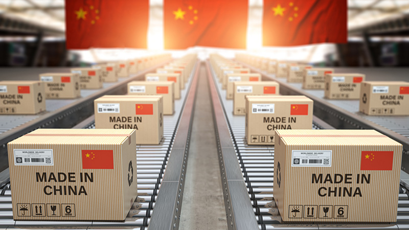 Made in China. Cardboard boxes with text made in China and chinese flag on the roller conveyor. 3d illustration