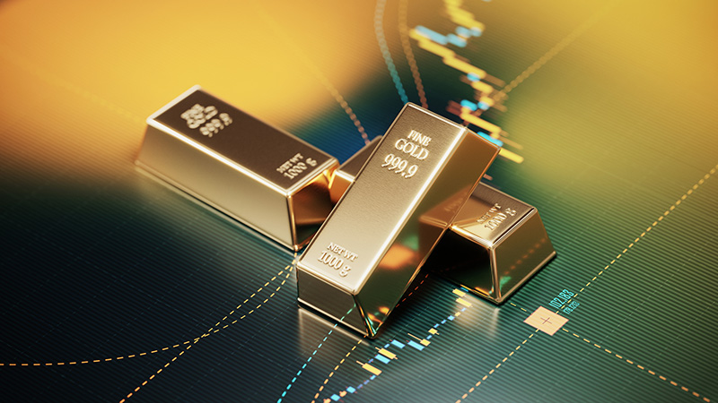 Gold bars sitting over a bar graph. Selective focus. Horizontal composition with copy space. Stock market and finance concept.